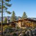 modern pine country home in prescott, arizona with large dual pane windows, stone and wood exterior, and mountain views.